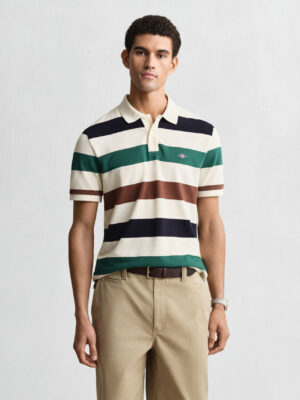 Man looking at the camera wearing a Gant striped polo